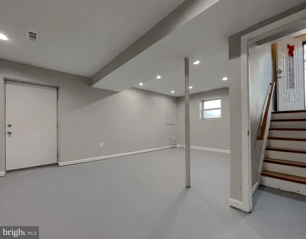 a bedroom with a bed and a book shelf