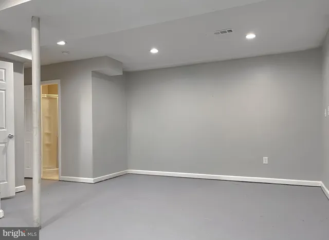 an empty room with a empty space and window