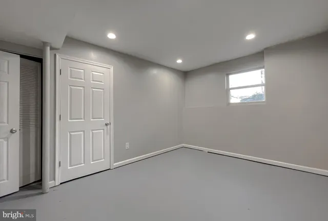 an empty room with a empty space and window