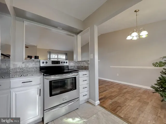 a white refrigerator freezer sitting inside of a kitchen