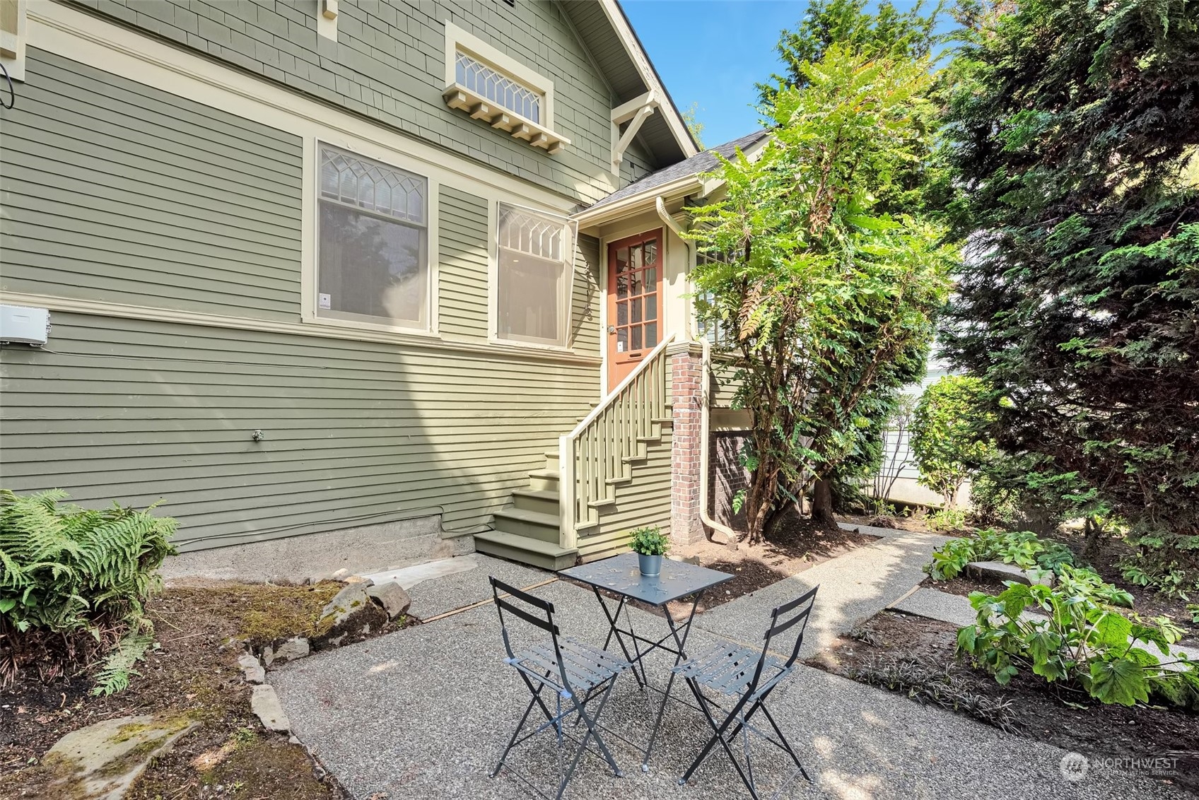 2115 3rd Avenue North Seattle, WA 98109 - Photo 1 of 1 a wooden bench sitting in front of a house