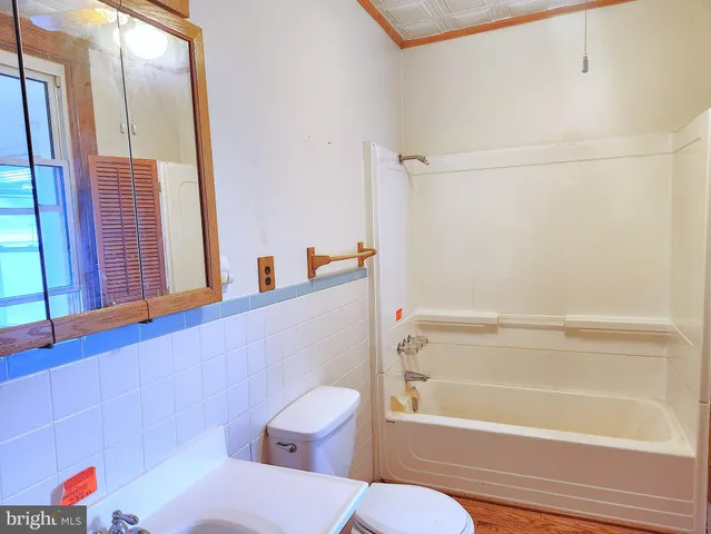 a bathroom with a bathtub and sink