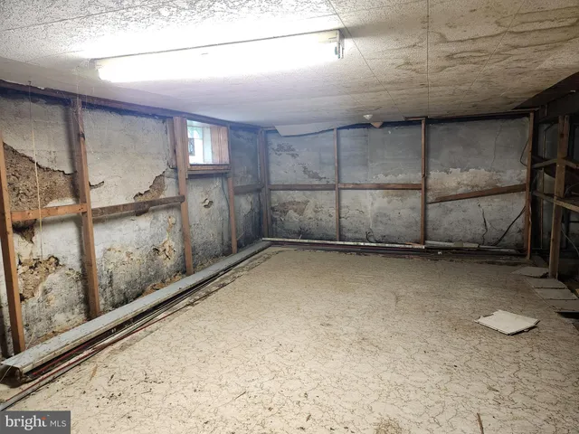 a view of a storage room with a view of the house