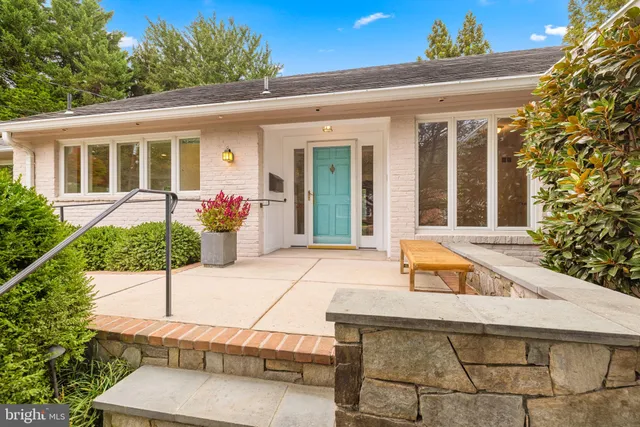 a view of house with outdoor space and sitting area