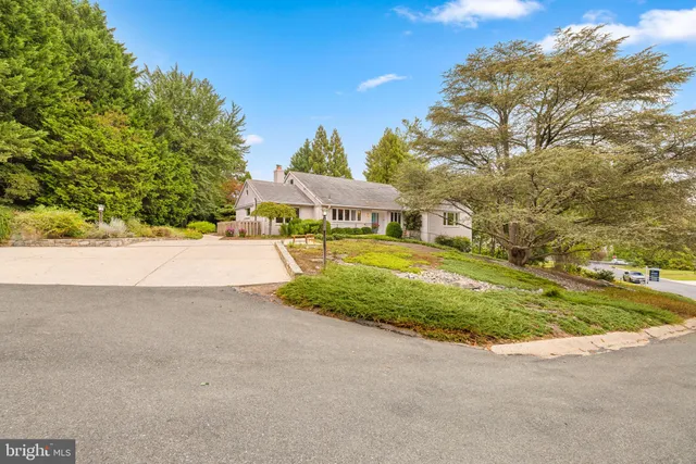 a view of a patio with a table and chairs
