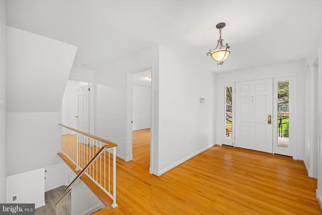 a view of an entryway with wooden floor