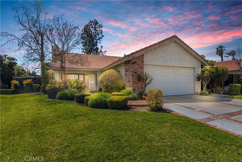 4880 Newport Lane Riverside, CA 92504 - Photo 1 of 1 a front view of a house with garden