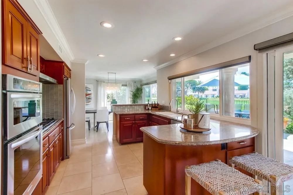16101 Via Madera Circa West Rancho Santa Fe, CA 92091 - Photo 15 of 56 a living room with stainless steel appliances granite countertop furniture and a kitchen view