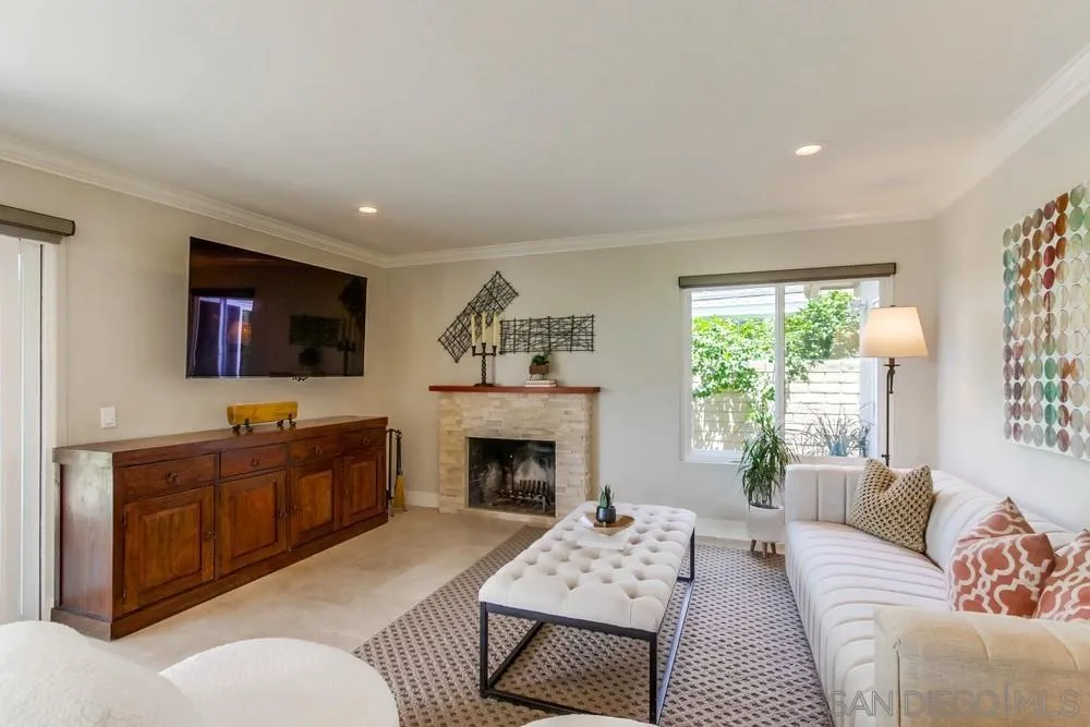 16101 Via Madera Circa West Rancho Santa Fe, CA 92091 - Photo 17 of 56 a living room with furniture a flat screen tv and a fireplace