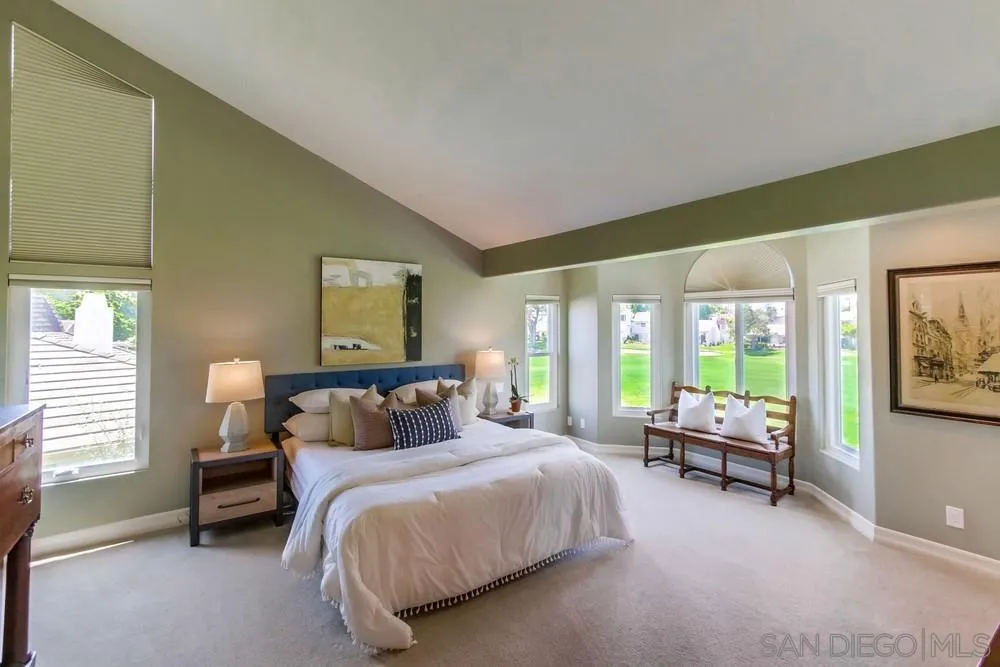 16101 Via Madera Circa West Rancho Santa Fe, CA 92091 - Photo 21 of 56 a bedroom with a bed and large windows