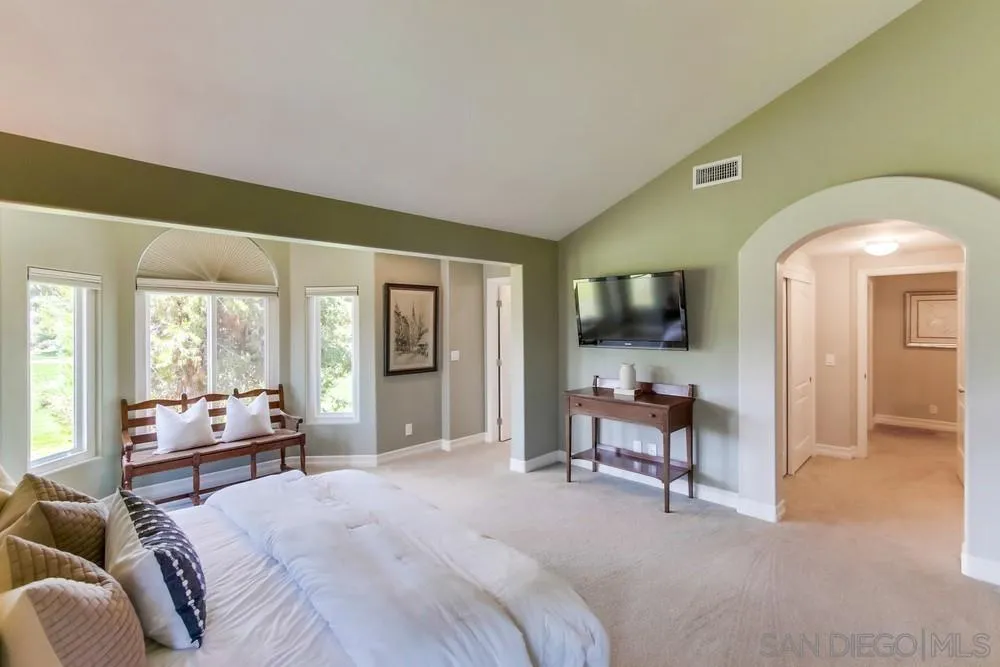 16101 Via Madera Circa West Rancho Santa Fe, CA 92091 - Photo 23 of 56 a bedroom with furniture and a large window