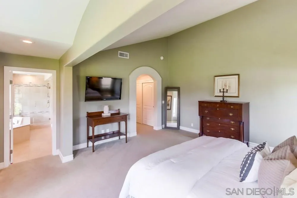 16101 Via Madera Circa West Rancho Santa Fe, CA 92091 - Photo 24 of 56 a bedroom with a bed and a flat screen tv
