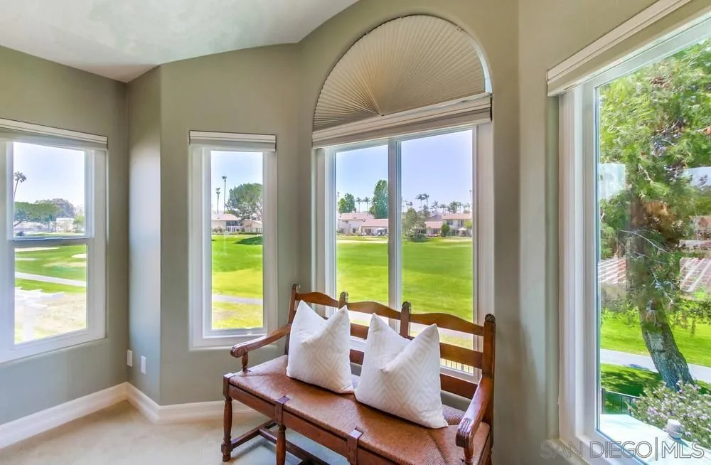16101 Via Madera Circa West Rancho Santa Fe, CA 92091 - Photo 25 of 56 a living room with large windows and wooden floor