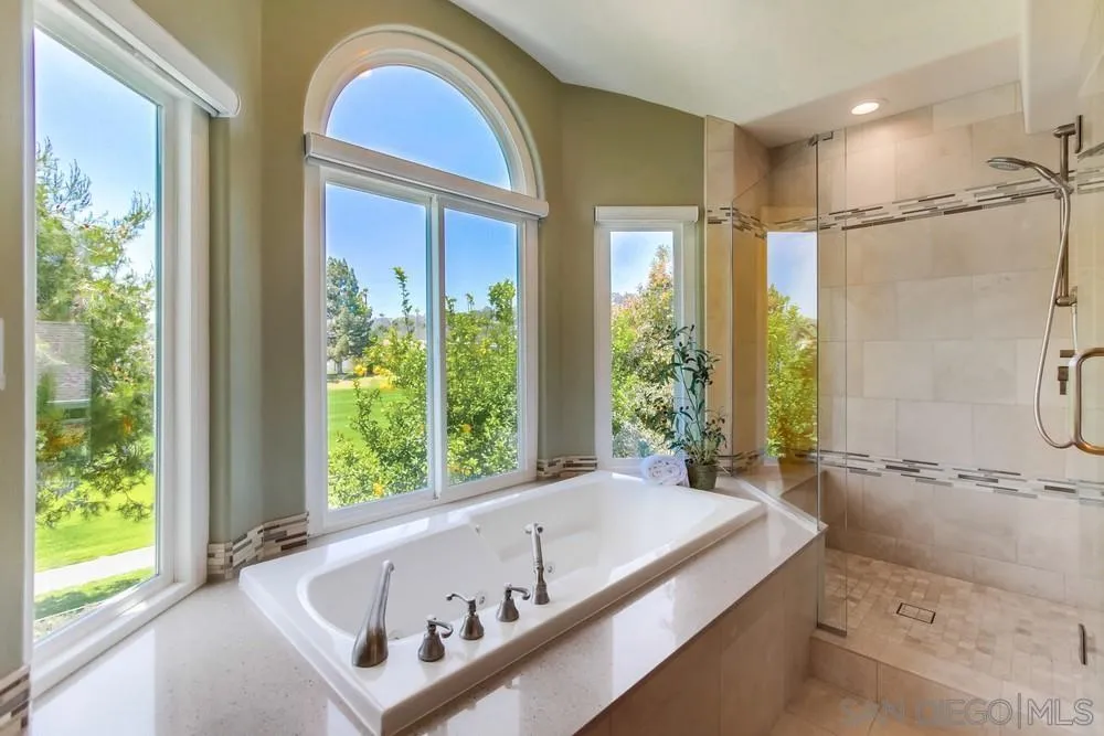 16101 Via Madera Circa West Rancho Santa Fe, CA 92091 - Photo 28 of 56 a bath tub sitting in a bathroom next to a window