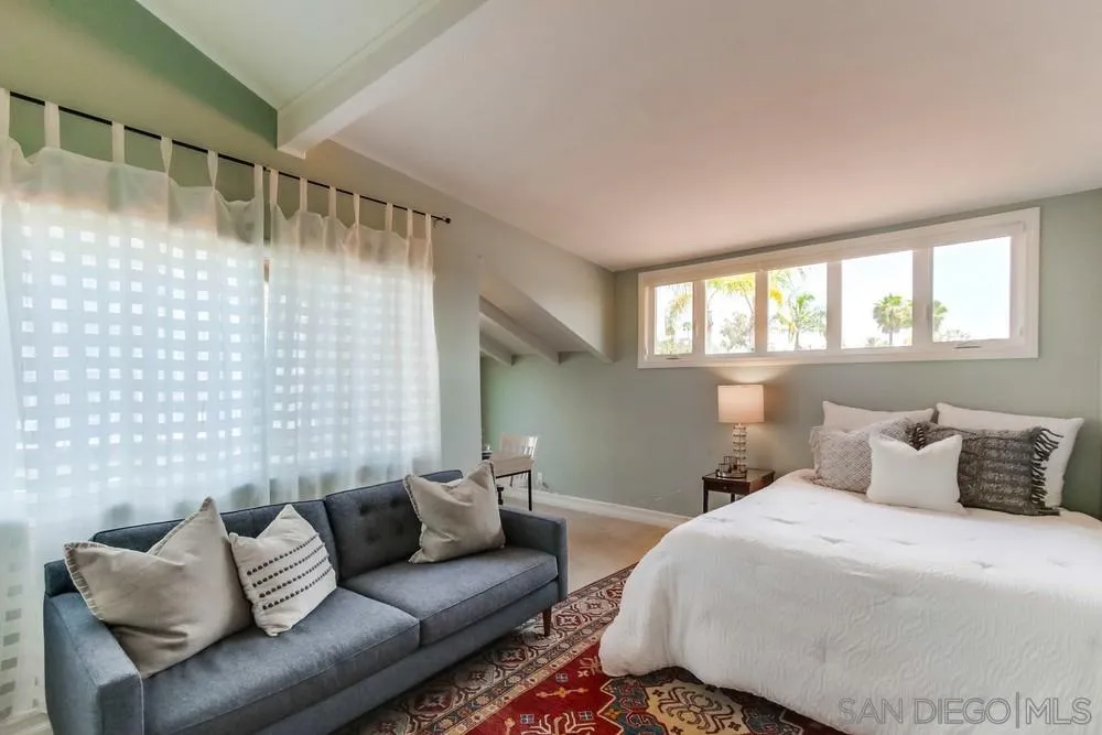 16101 Via Madera Circa West Rancho Santa Fe, CA 92091 - Photo 29 of 56 a bedroom with a bed couch and window