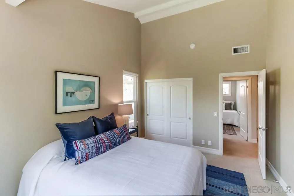 16101 Via Madera Circa West Rancho Santa Fe, CA 92091 - Photo 32 of 56 a bedroom with a bed and wooden floor