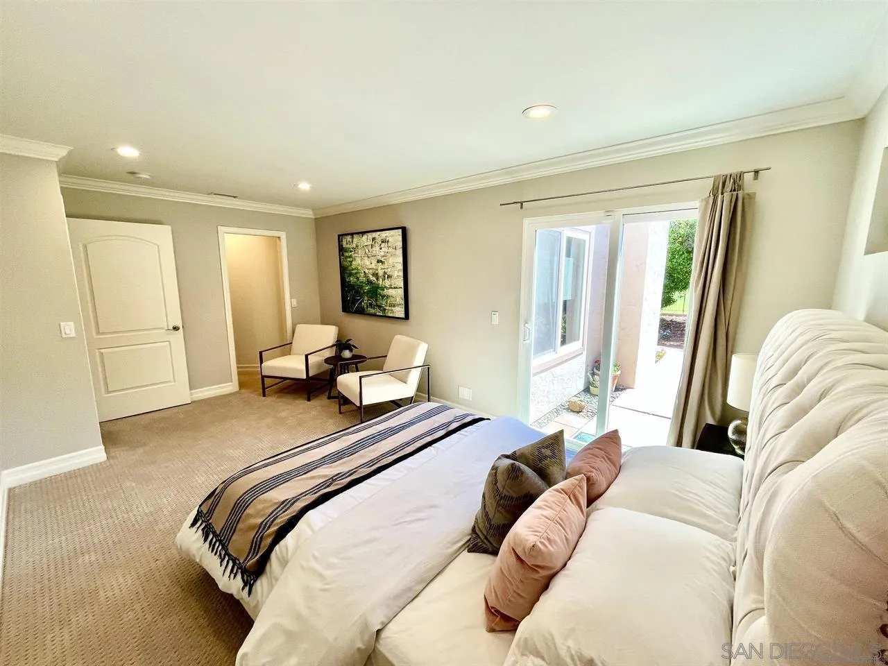 16101 Via Madera Circa West Rancho Santa Fe, CA 92091 - Photo 35 of 56 a bedroom with a bed and wooden floor