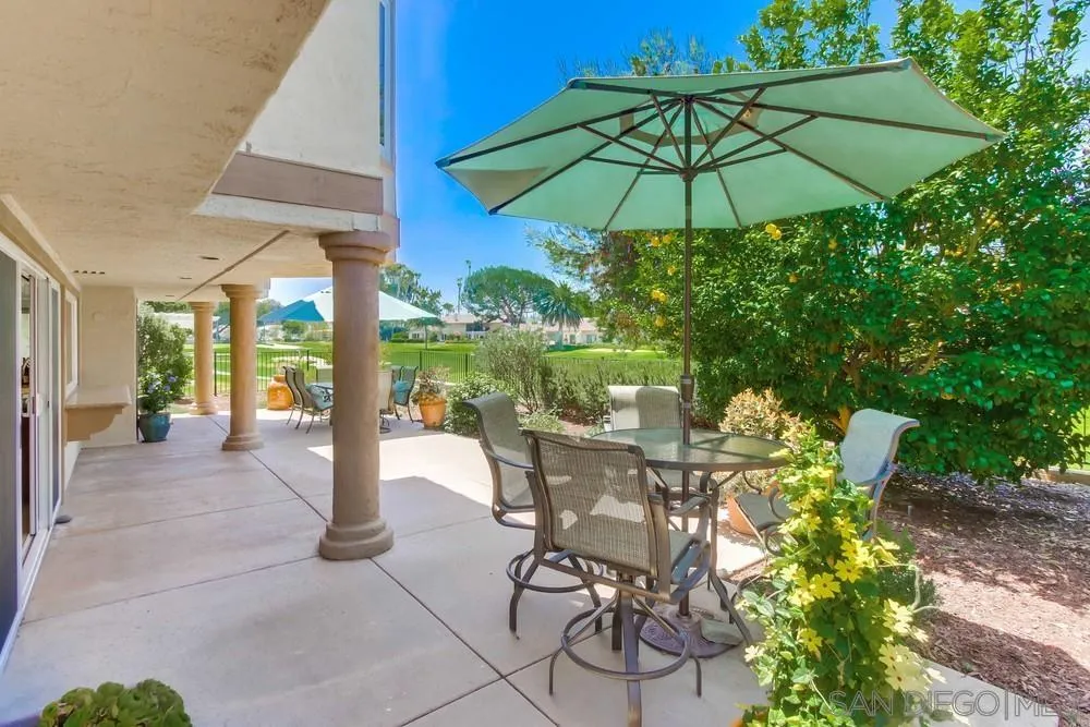 16101 Via Madera Circa West Rancho Santa Fe, CA 92091 - Photo 38 of 56 a patio with a patio table and chairs
