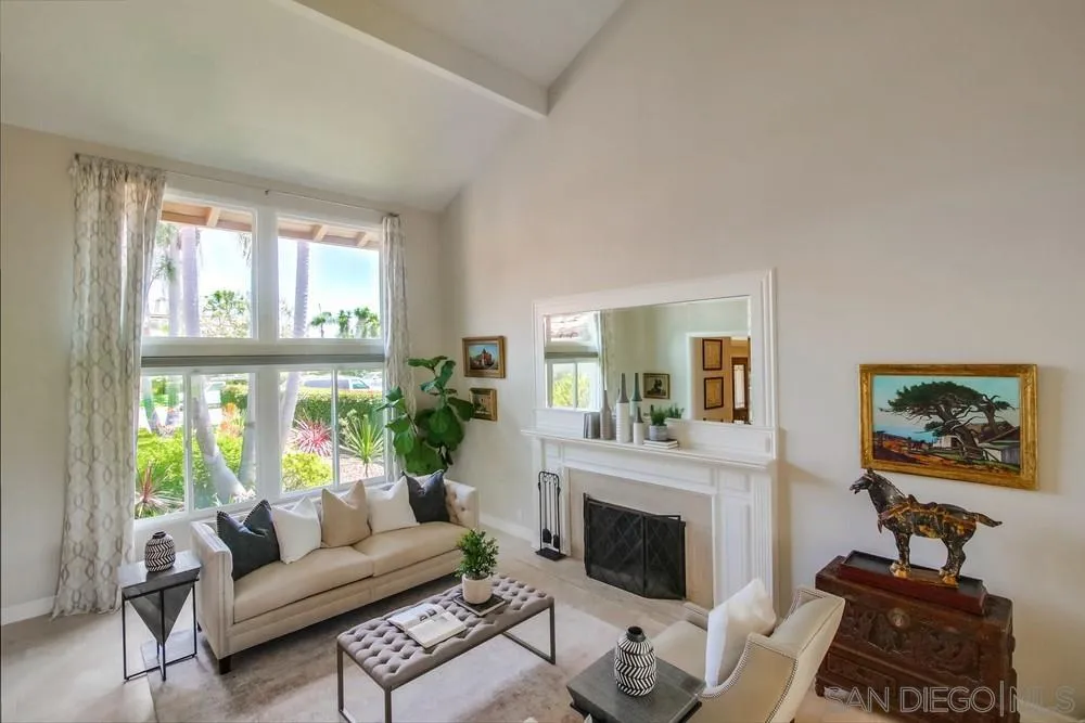 16101 Via Madera Circa West Rancho Santa Fe, CA 92091 - Photo 8 of 56 a living room with furniture a fireplace and a large window