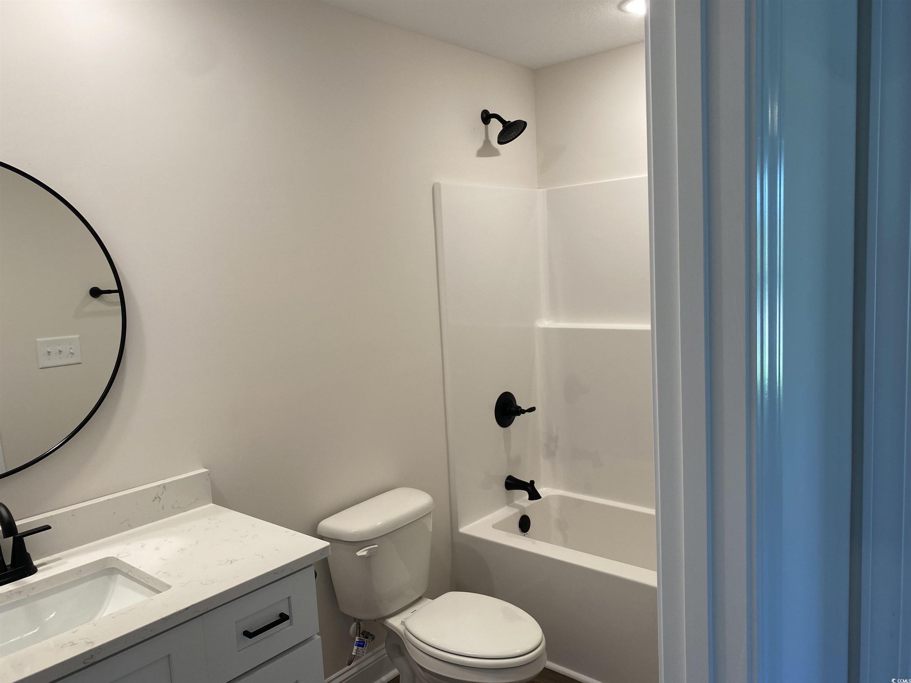 3397 Dusty Road Loris, SC 29569 - Photo 3 of 10 Full bathroom with vanity, toilet, and shower / ba