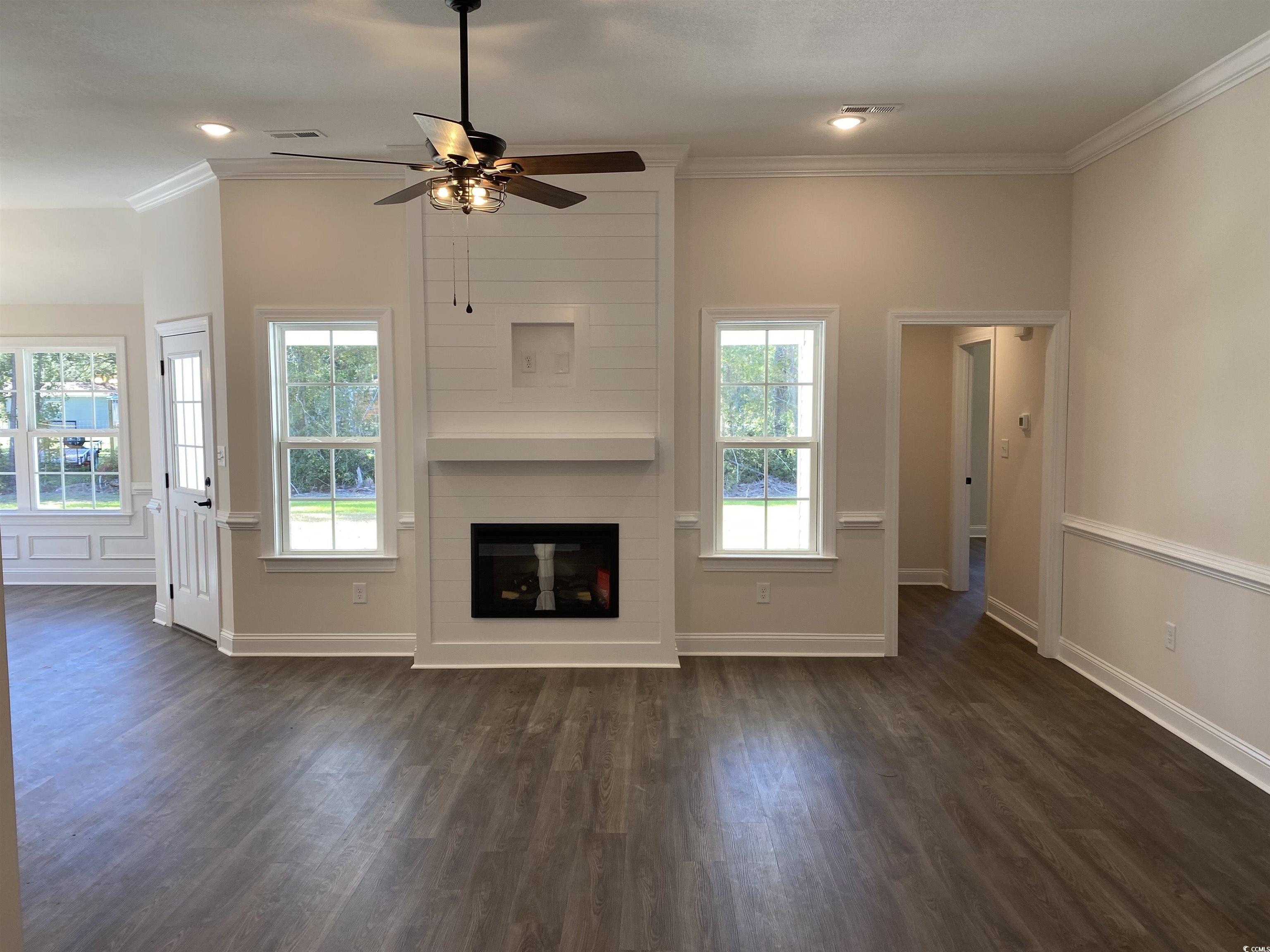 3397 Dusty Road Loris, SC 29569 - Photo 6 of 10 Unfurnished living room with dark wood-type floori