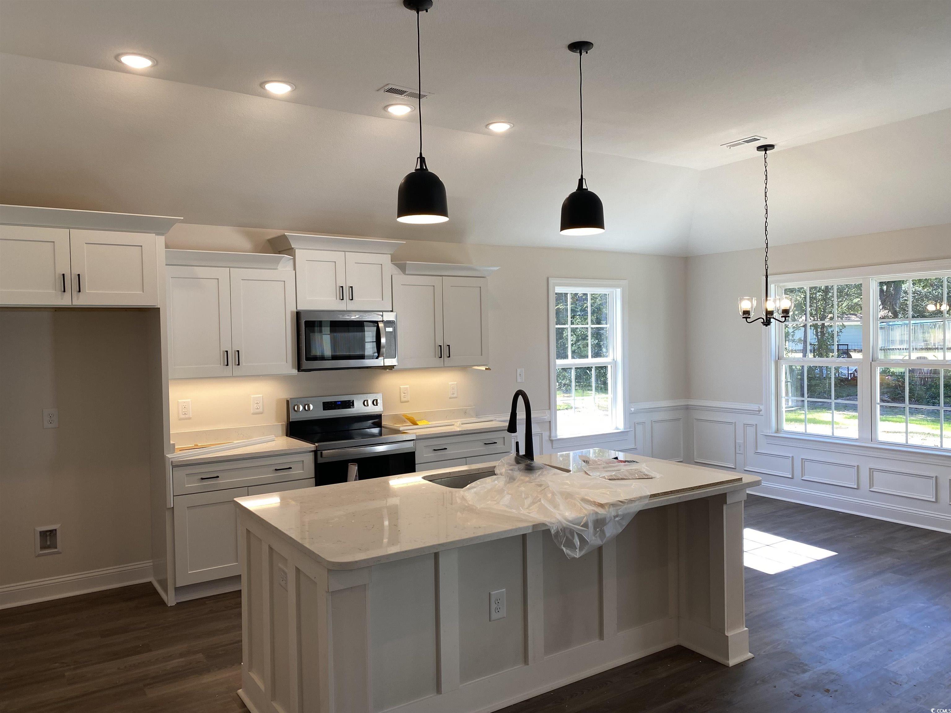 3397 Dusty Road Loris, SC 29569 - Photo 7 of 10 Kitchen with lofted ceiling, a center island with