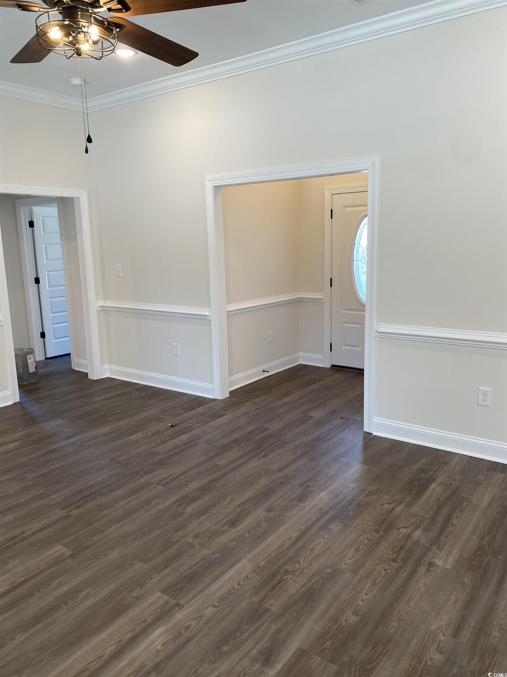 3397 Dusty Road Loris, SC 29569 - Photo 8 of 10 Empty room with crown molding, dark hardwood / woo