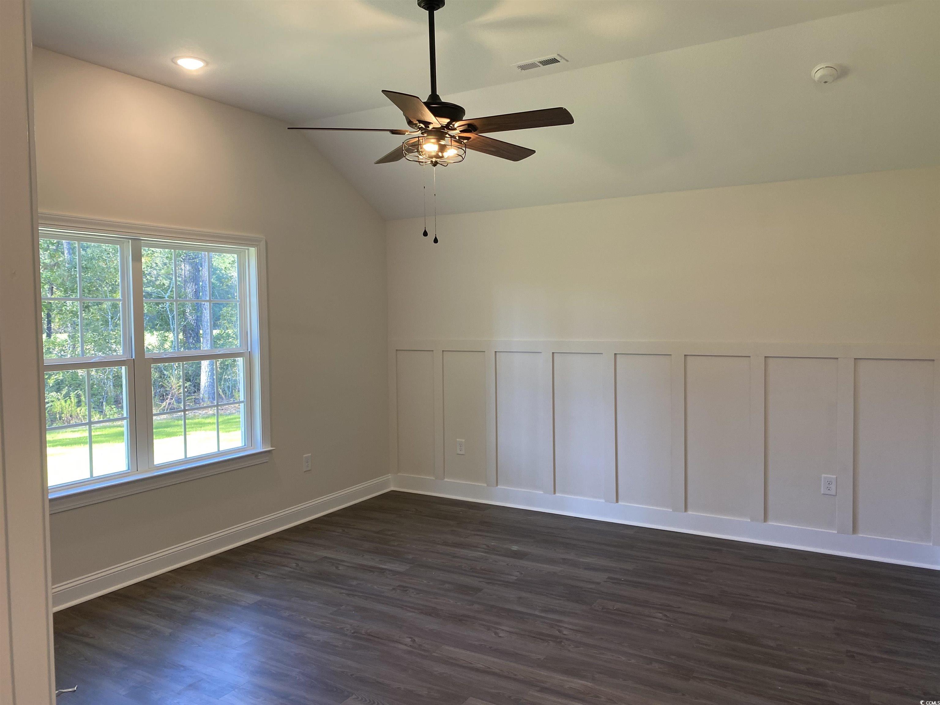 3397 Dusty Road Loris, SC 29569 - Photo 10 of 10 Unfurnished room featuring vaulted ceiling, dark h