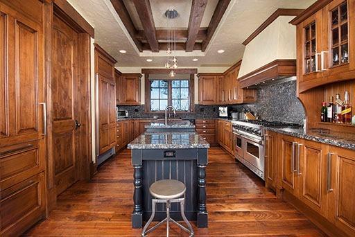 3618 Daybreak Ridge Road Avon, CO 81620 - Photo 4 of 14 a kitchen with stainless steel appliances granite countertop a stove and a wooden floors