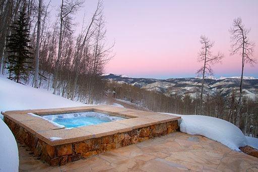 3618 Daybreak Ridge Road Avon, CO 81620 - Photo 8 of 14 a view of a swimming pool with a yard