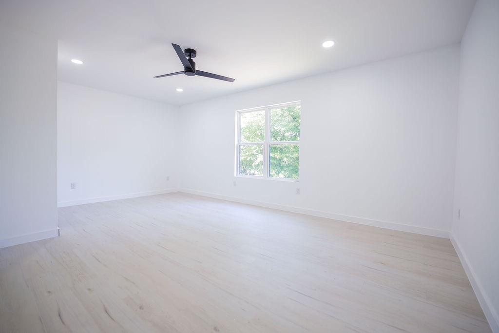 250 Skyview Point, TX 75472 - Photo 13 of 23 an empty room with windows and ceiling fan