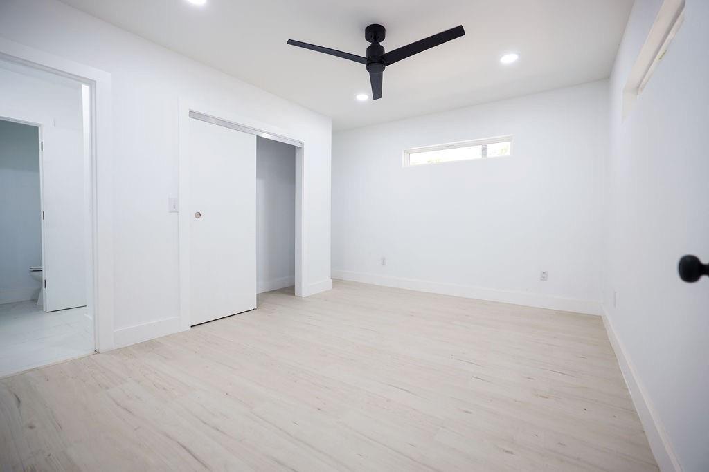 250 Skyview Point, TX 75472 - Photo 15 of 23 an empty room with a ceiling fan and a window