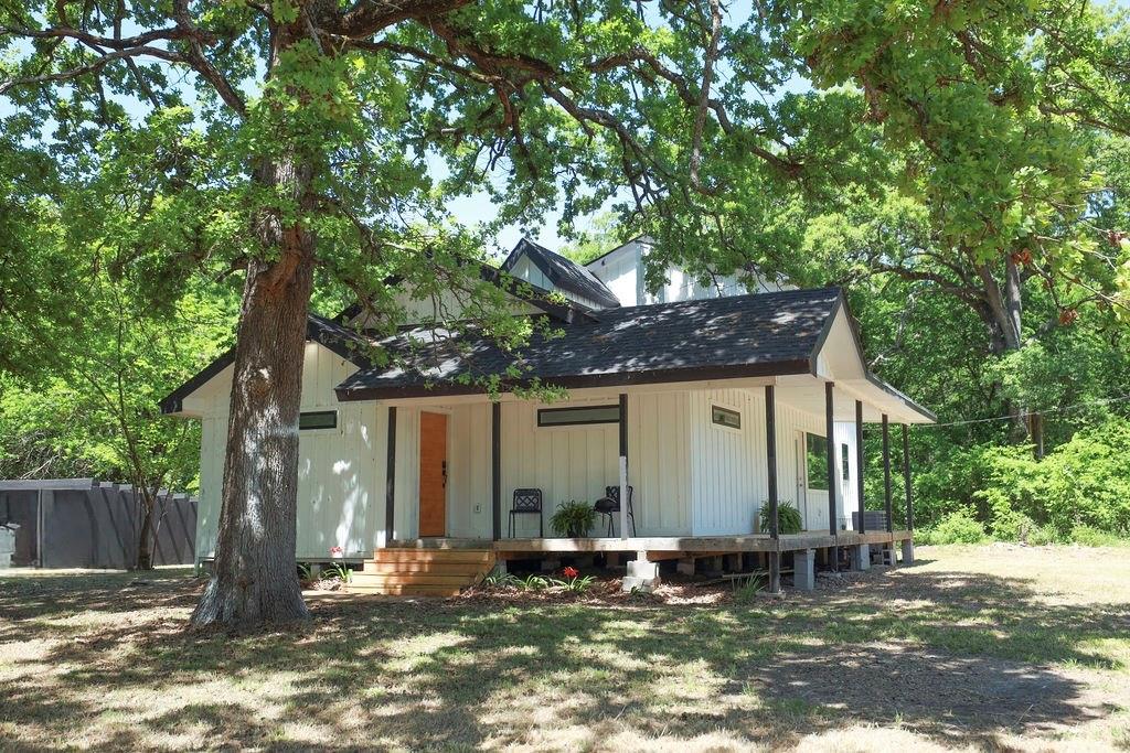 250 Skyview Point, TX 75472 - Photo 17 of 23 a backyard of a house with yard and tree