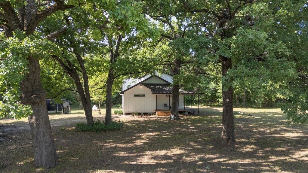 250 Skyview Point, TX 75472 - Photo 18 of 23 a front view of a house with a tree in the background