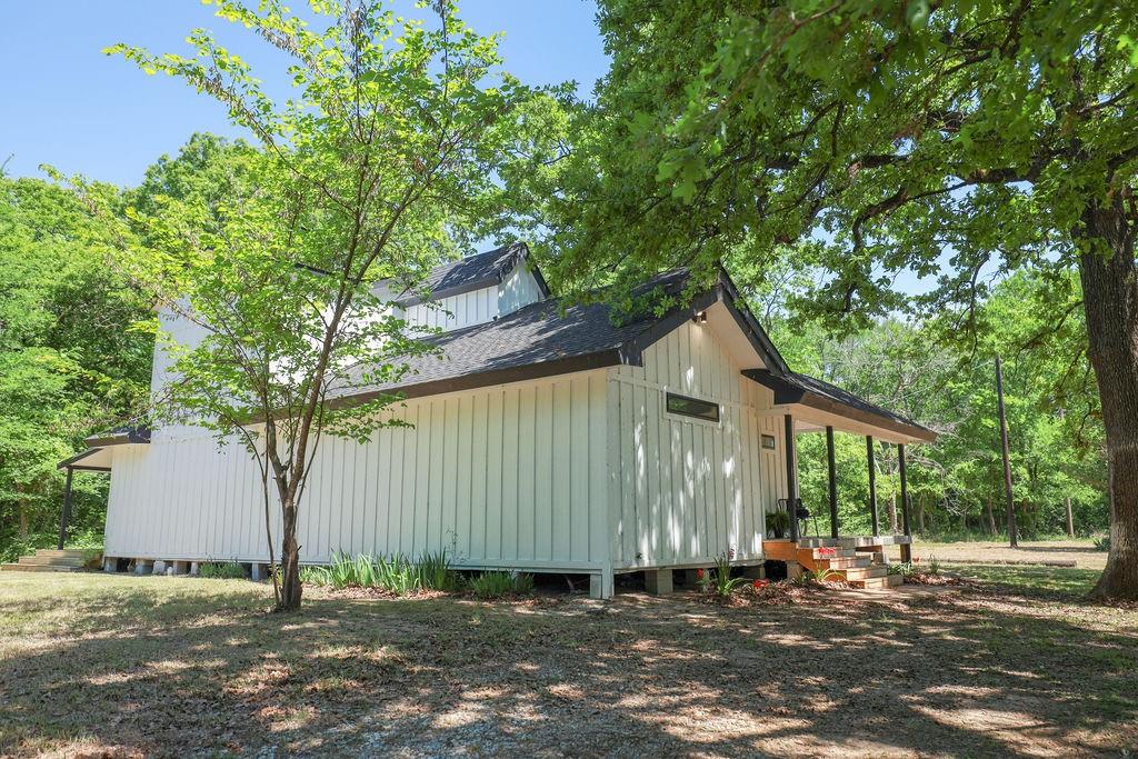 250 Skyview Point, TX 75472 - Photo 21 of 23 a house with a tree in front of it