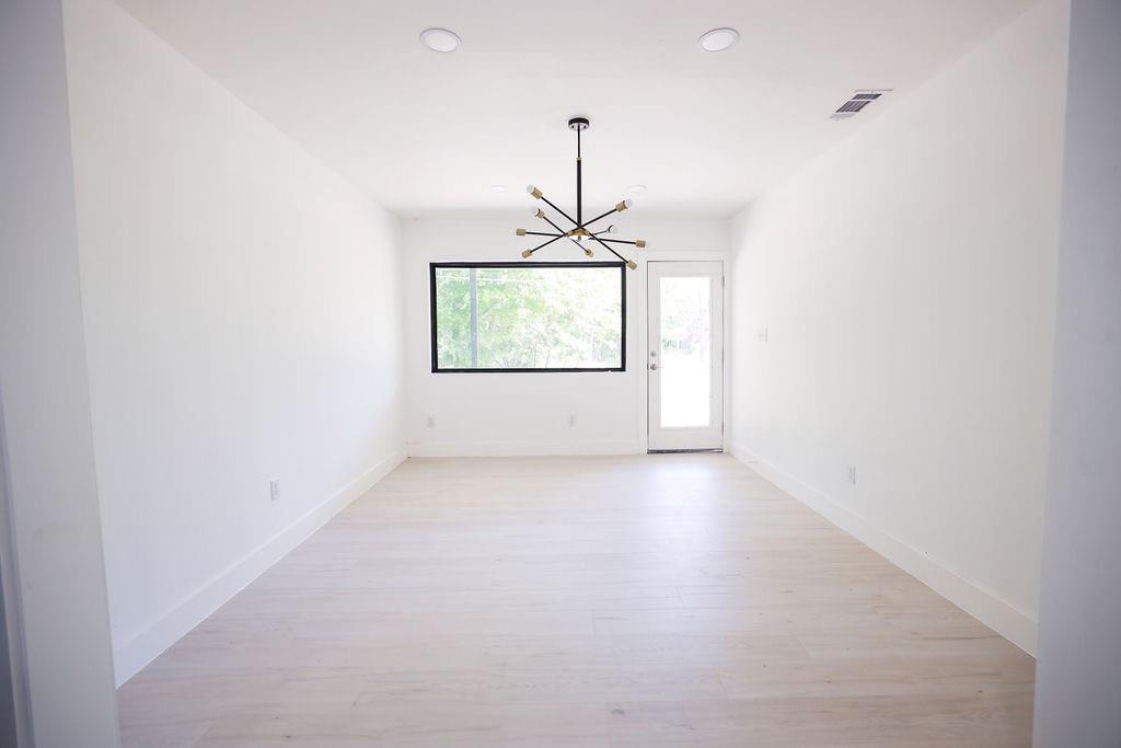 250 Skyview Point, TX 75472 - Photo 10 of 23 an empty room with a window and a ceiling fan