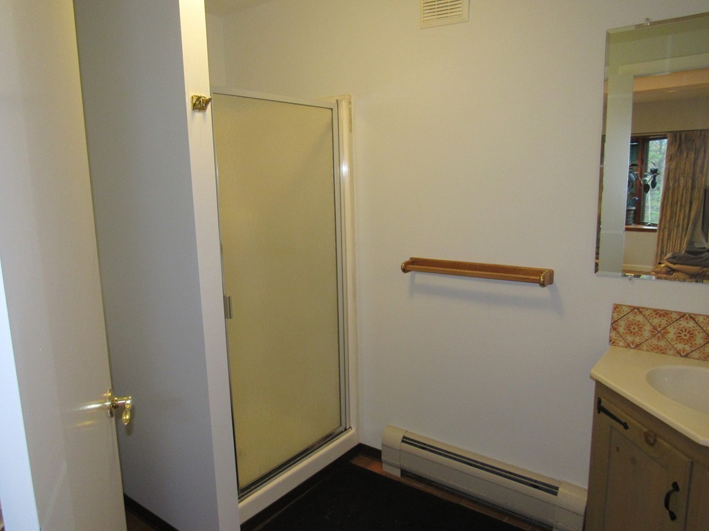 135 Fomer Road Southampton, MA 01073 - Photo 19 of 19 a bathroom with a sink and a mirror