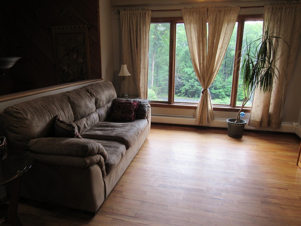 135 Fomer Road Southampton, MA 01073 - Photo 7 of 19 a living room with furniture and a large window