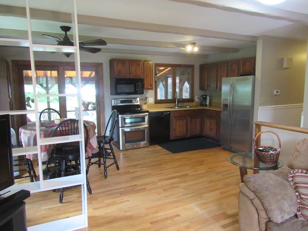 135 Fomer Road Southampton, MA 01073 - Photo 9 of 19 a kitchen with stainless steel appliances granite countertop a sink and a refrigerator