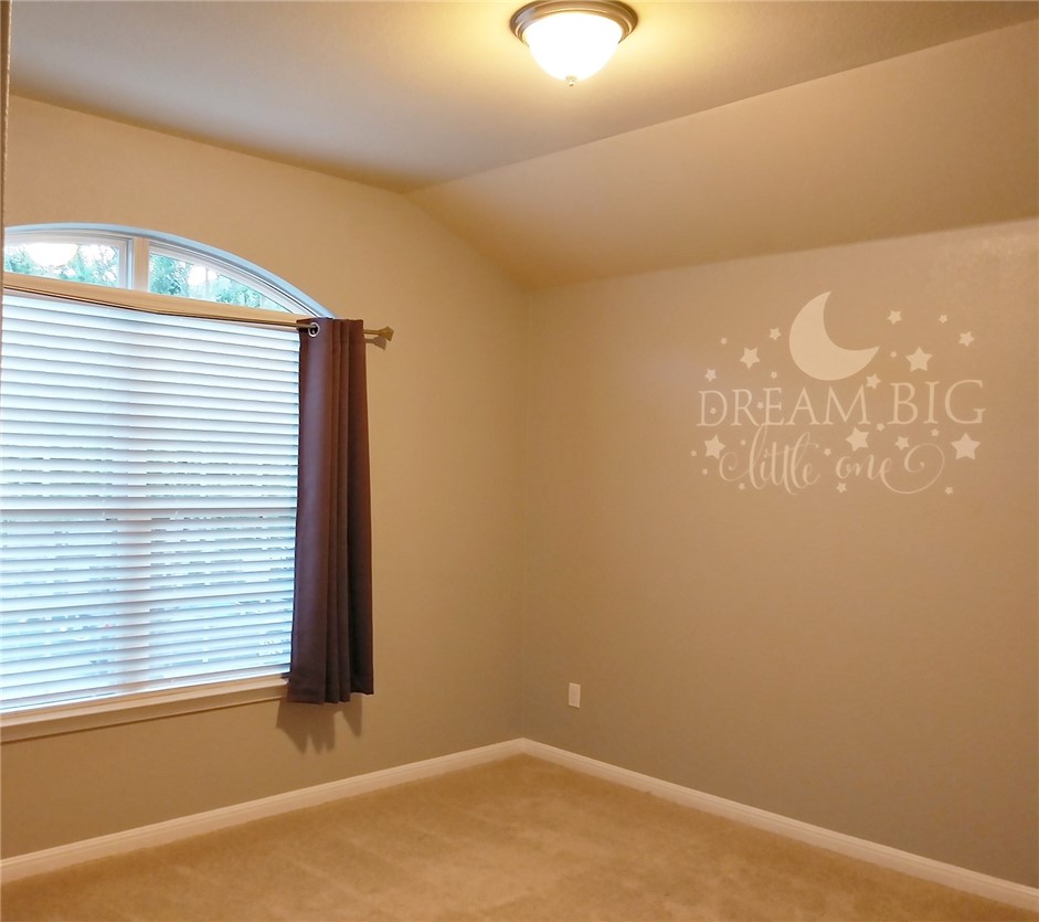 348 Stone View Trail Austin, TX 78737 - Photo 16 of 26 Bedroom with large window facing the front yard