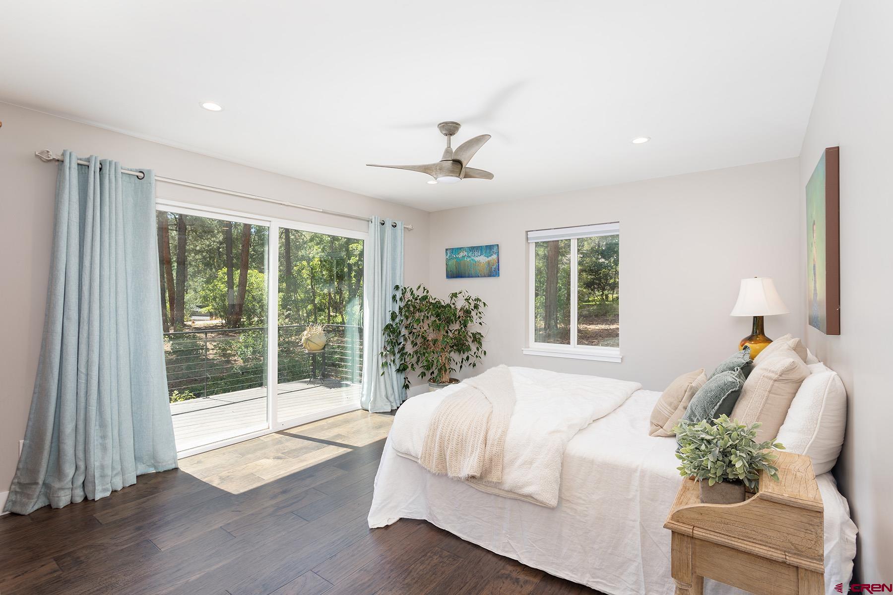 436 The Eagle Pass Durango, CO 81301 - Photo 14 of 29 a bed sitting in a spacious bedroom next to a window