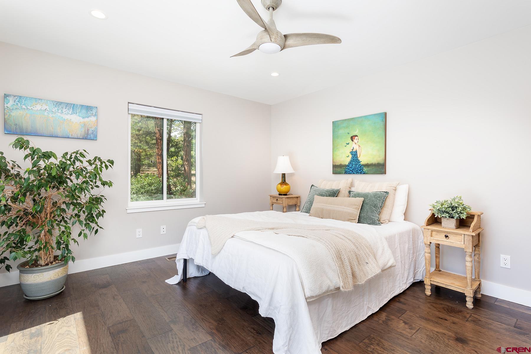 436 The Eagle Pass Durango, CO 81301 - Photo 15 of 29 a bedroom with a bed and a potted plant