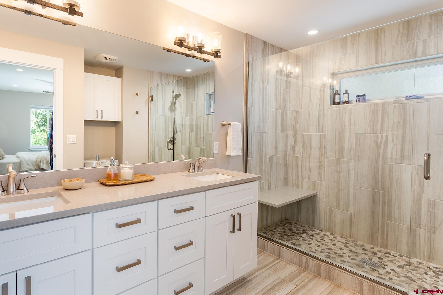 436 The Eagle Pass Durango, CO 81301 - Photo 16 of 29 a bathroom with a double vanity sink mirror and double