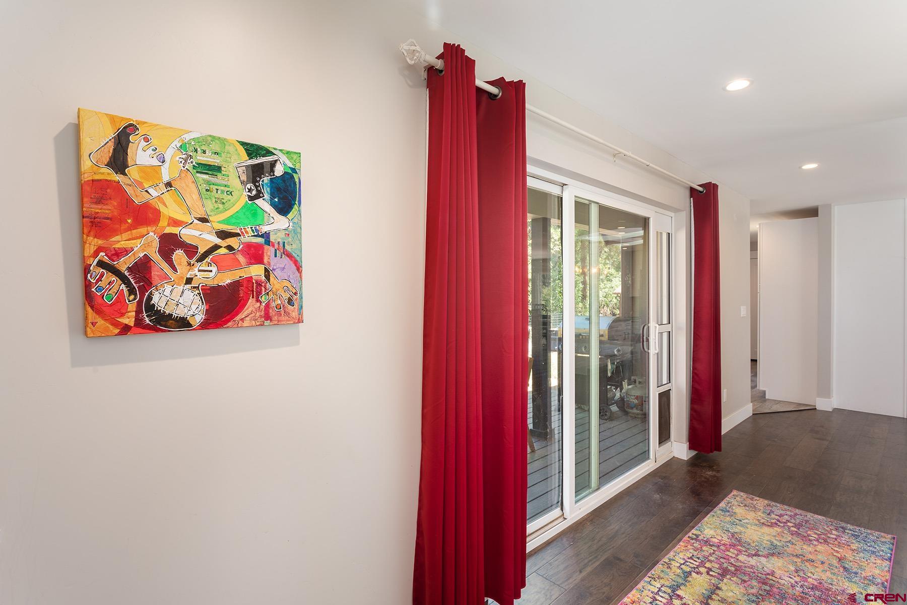 436 The Eagle Pass Durango, CO 81301 - Photo 19 of 29 a view of a bedroom with a bed and wooden floor