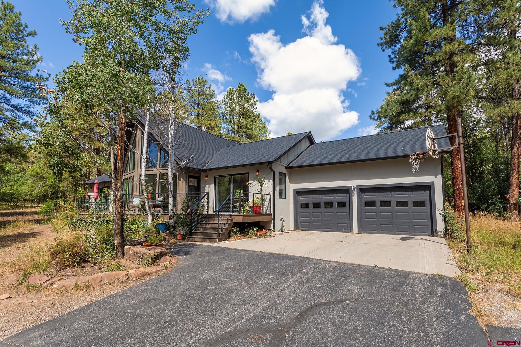 436 The Eagle Pass Durango, CO 81301 - Photo 23 of 29 a view of a house with a garage and balcony