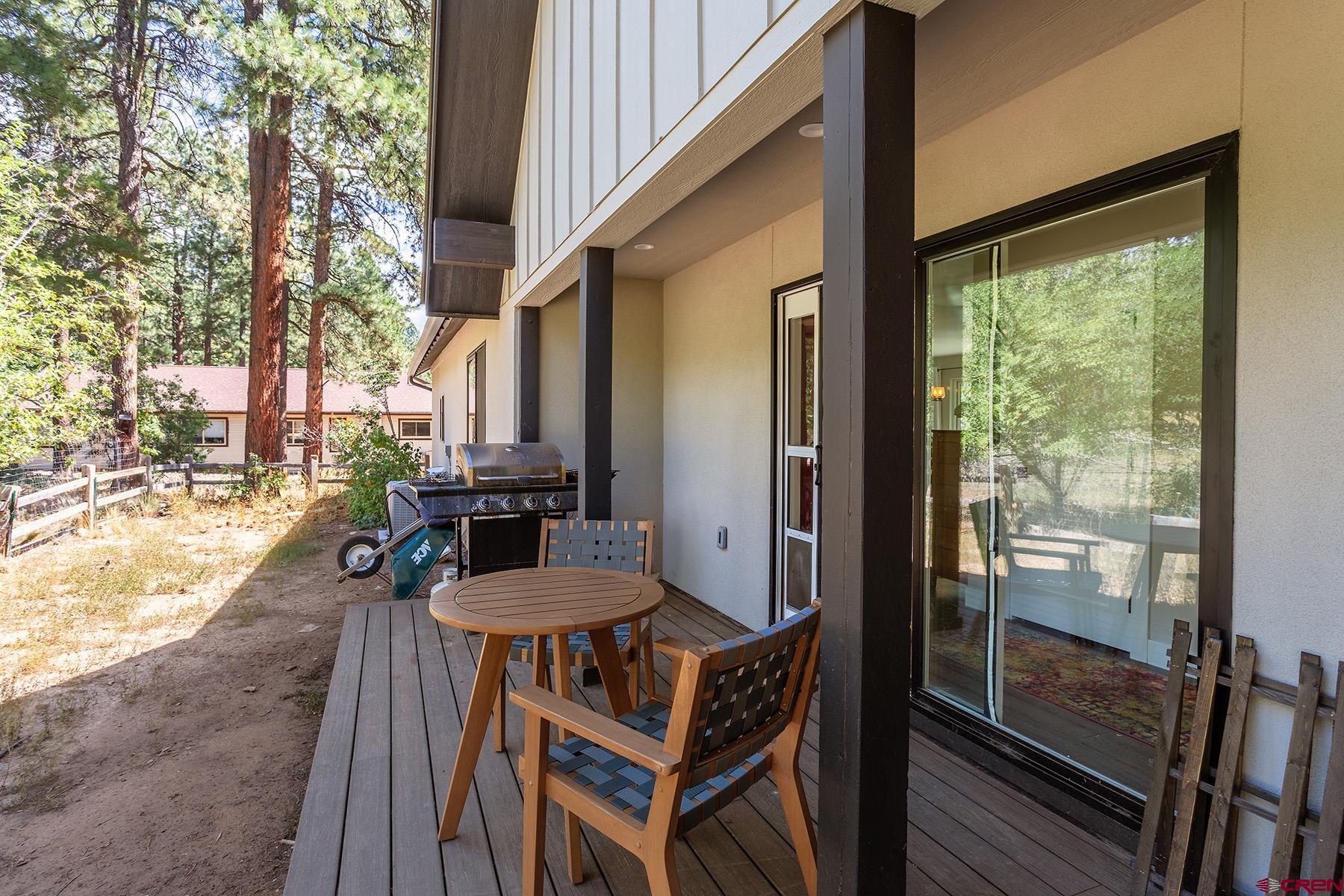 436 The Eagle Pass Durango, CO 81301 - Photo 26 of 29 a outdoor space with patio the couches and a dining table with garden view