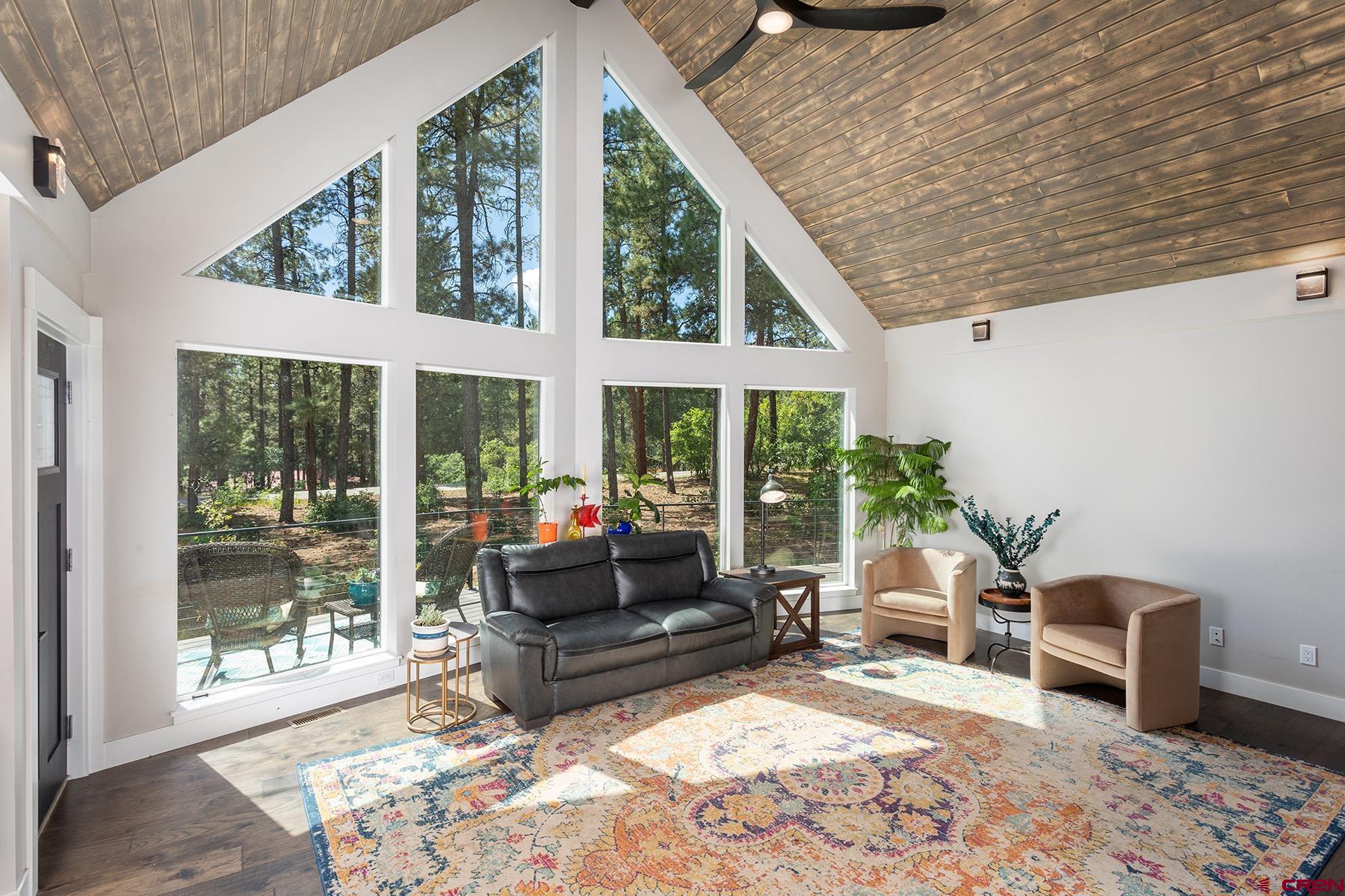 436 The Eagle Pass Durango, CO 81301 - Photo 3 of 29 a living room with furniture and a large window