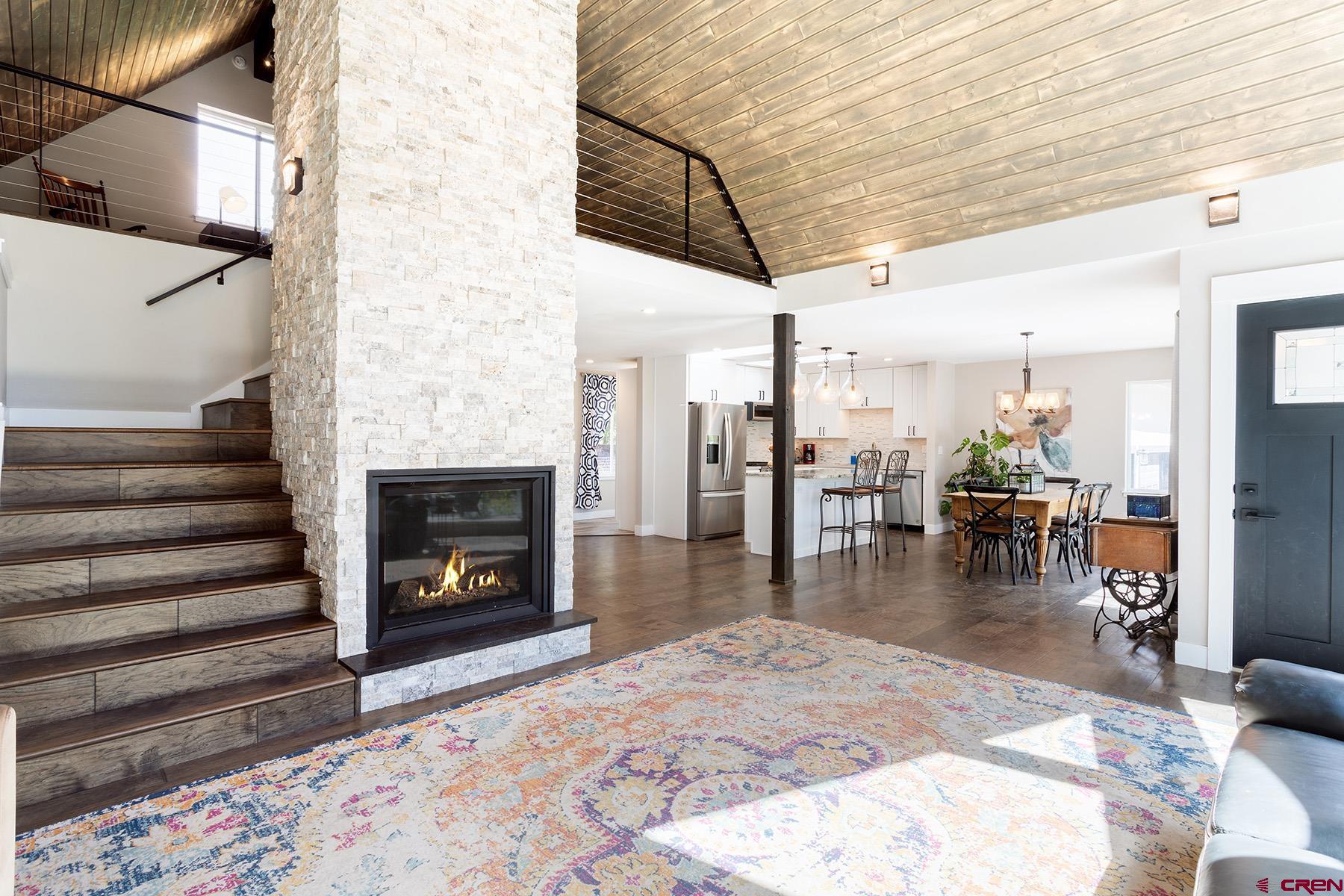 436 The Eagle Pass Durango, CO 81301 - Photo 7 of 29 a living room with furniture and a fireplace