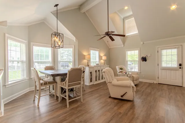a living room with furniture a window and appliances