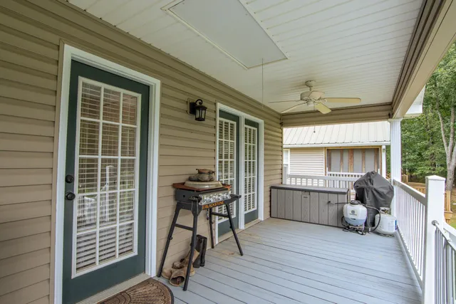 a view of a deck with wooden floor and iron stairs